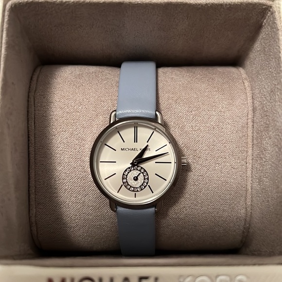 Almost New. Michael Kors Watch. Leather baby blue adjustable strap.